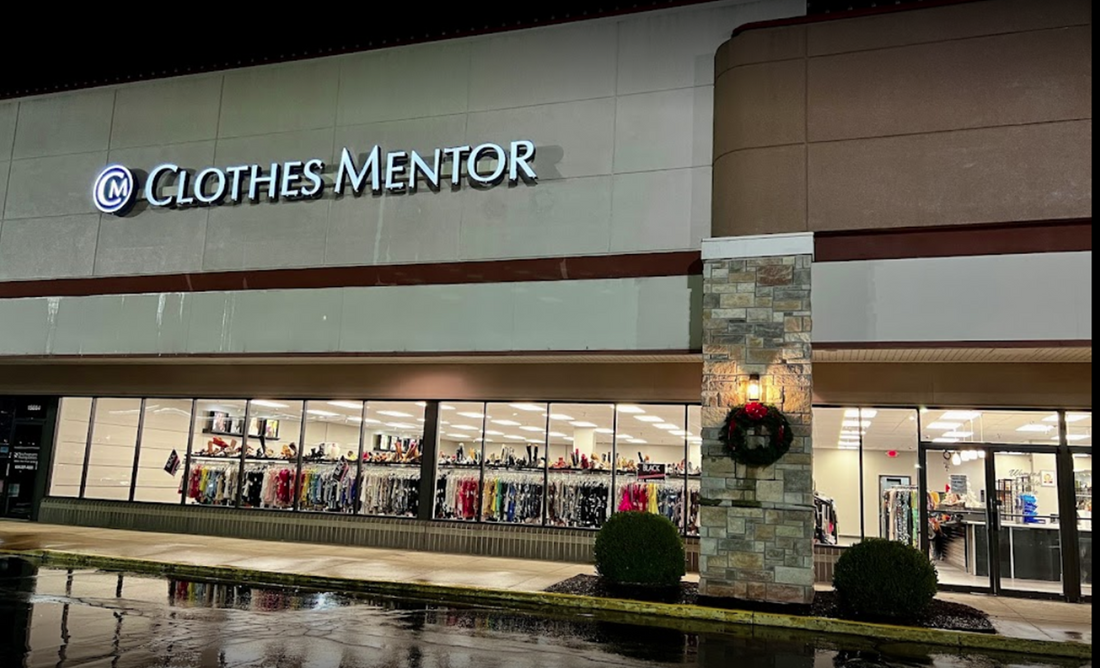 Exterior of Clothes Mentor Ellisville store at night, signage visible